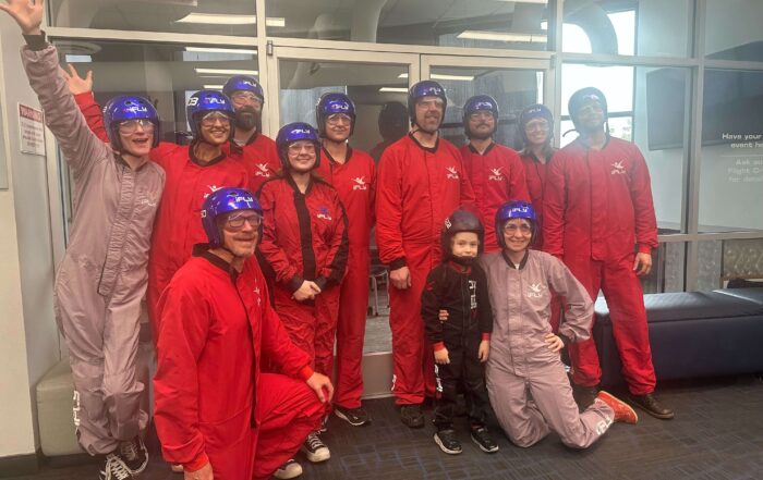 To strengthen social connections, our team went indoor skydiving.