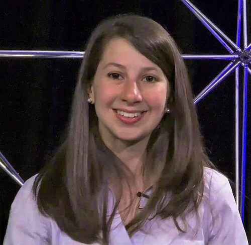 This image shows Katie Bouman, a computer scientist known for helping develop the imaging algorithms that contributed to the world’s first image of a black hole in April 2019. She's one of the most powerful examples of women in STEM fields.