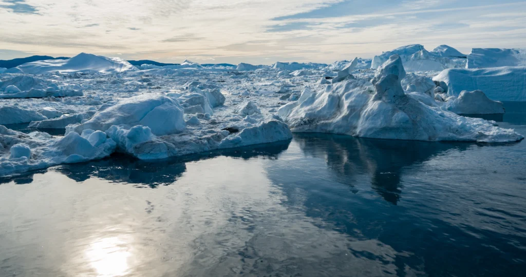 This is a drone photo of ice from a glacier in the arctic that's affected by global warming; visualizing climate change data from here would require maps and graphs.